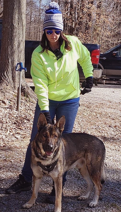 A photo of founder Amy Tipton with her K9